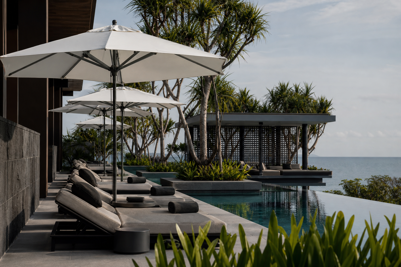 Coordinated parasols across a contemporary coastal resort