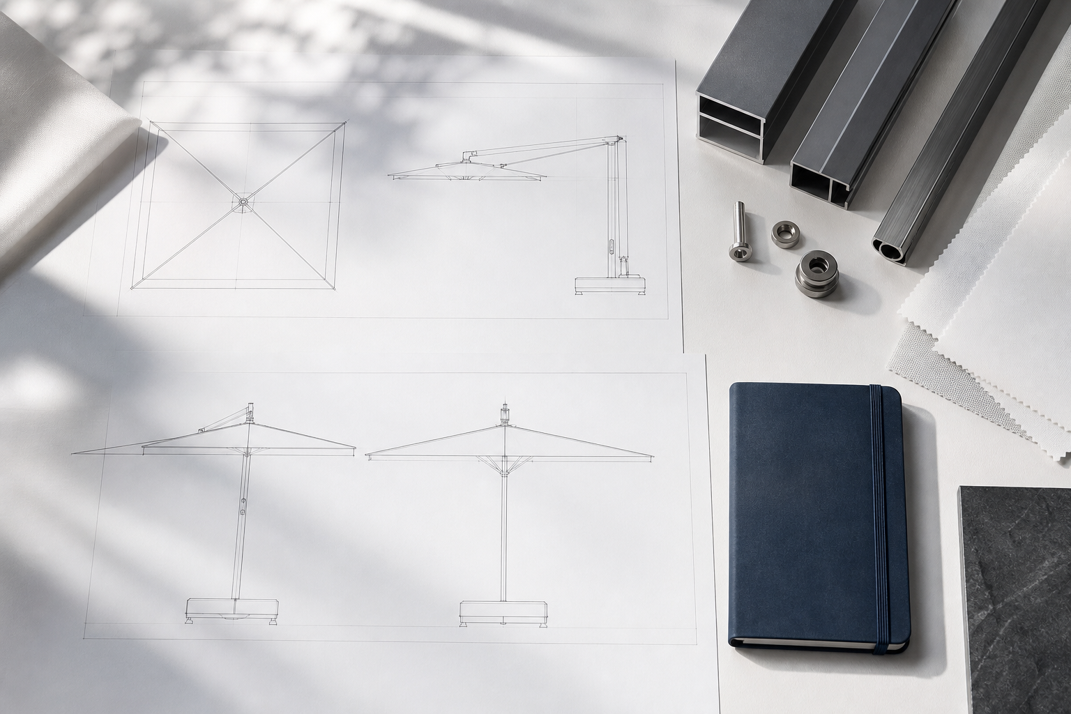 Parasol specification drawings and material samples on a project desk